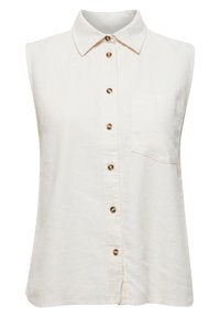 Ärmlös krämfärgad linne skjorta med krage, guldfärgade knappar längs fram och en enda ficka på vänster bröst. Slät textur, avslappnad design.