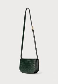 Green crocodile-embossed leather crossbody bag with a flat rectangular shape, adjustable strap, and gold-tone hardware detail.