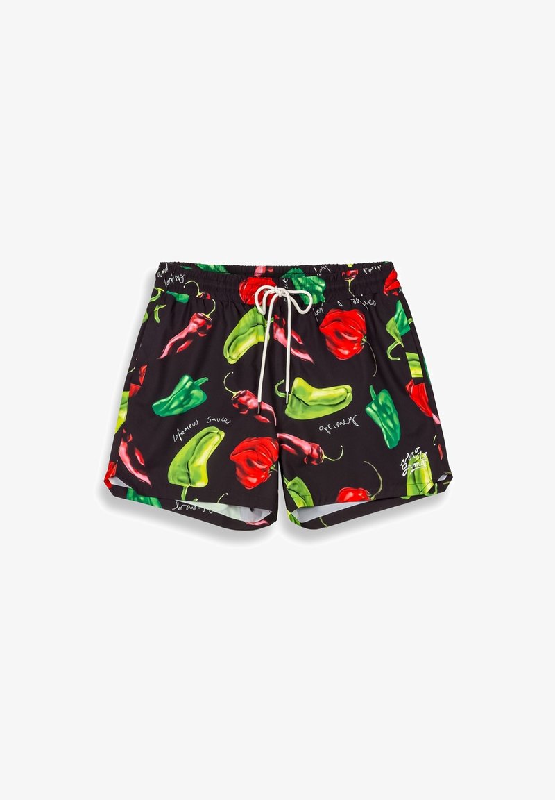 Bañador negro con un vívido estampado de chiles rojos y verdes, cordón ajustable blanco y una textura suave.