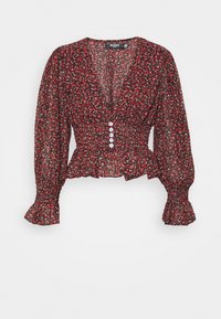 Blouse florale rouge avec de longues manches bouffantes. Présente un décolleté en V, une taille froncée et cinq boutons blancs sur le devant. Tissu léger.