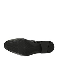 Suola di scarpa nera con una superficie testurizzata e decorata per garantire aderenza e una punta arrotondata. Realizzata in materiale gommoso durevole con una finitura liscia.
