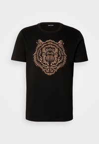 Black cotton t-shirt featuring a detailed orange tiger head graphic with fine line patterns. Classic crew neck and short sleeves.