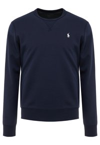 Navyblå crewneck sweatshirt gjord av bomullsmaterial. Har ribbade cuffs och nederkant, med en liten vit polo-logotyp på vänster bröst.