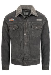 Grijze corduroy jas met een zachte sherpa kraag, twee borstzakken en geborduurde patches. Voorzien van knoopsluitingen en een gestructureerde afwerking.