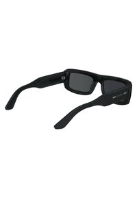 Black sunglasses with a rectangular frame, solid black plastic material, and gray lenses. Features subtle logo detail on the temple.