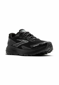 Musta juoksukengät, joissa on teksturoitu GORE-TEX-päällinen, heijastavat yksityiskohdat, pehmeä pohja ja kova pito erilaisilla pinnoilla.