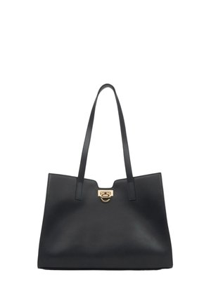Black leather tote bag with two long handles, features a gold-tone hardware accent at the top, sleek design, smooth texture.