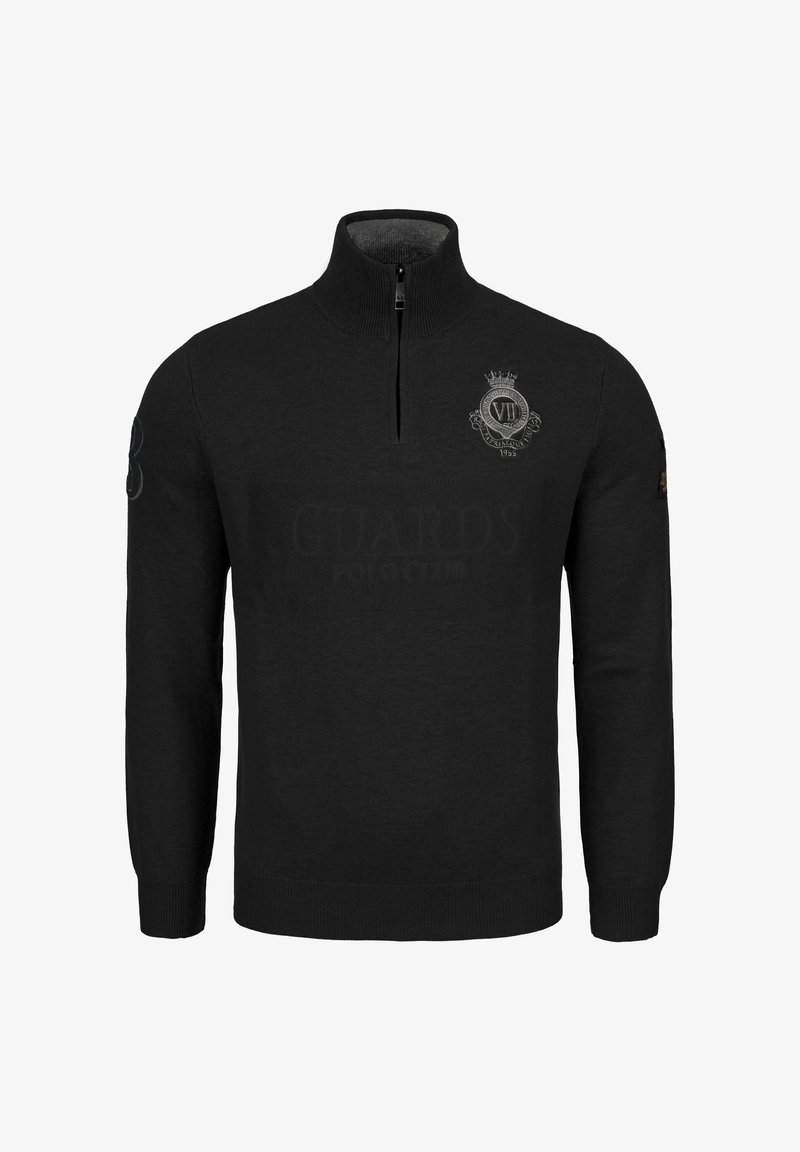 Pull en tricot noir avec un zip demi-long, des poignets et un ourlet côtelés. Présente un logo sur la poitrine et un accent brodé sur la manche.