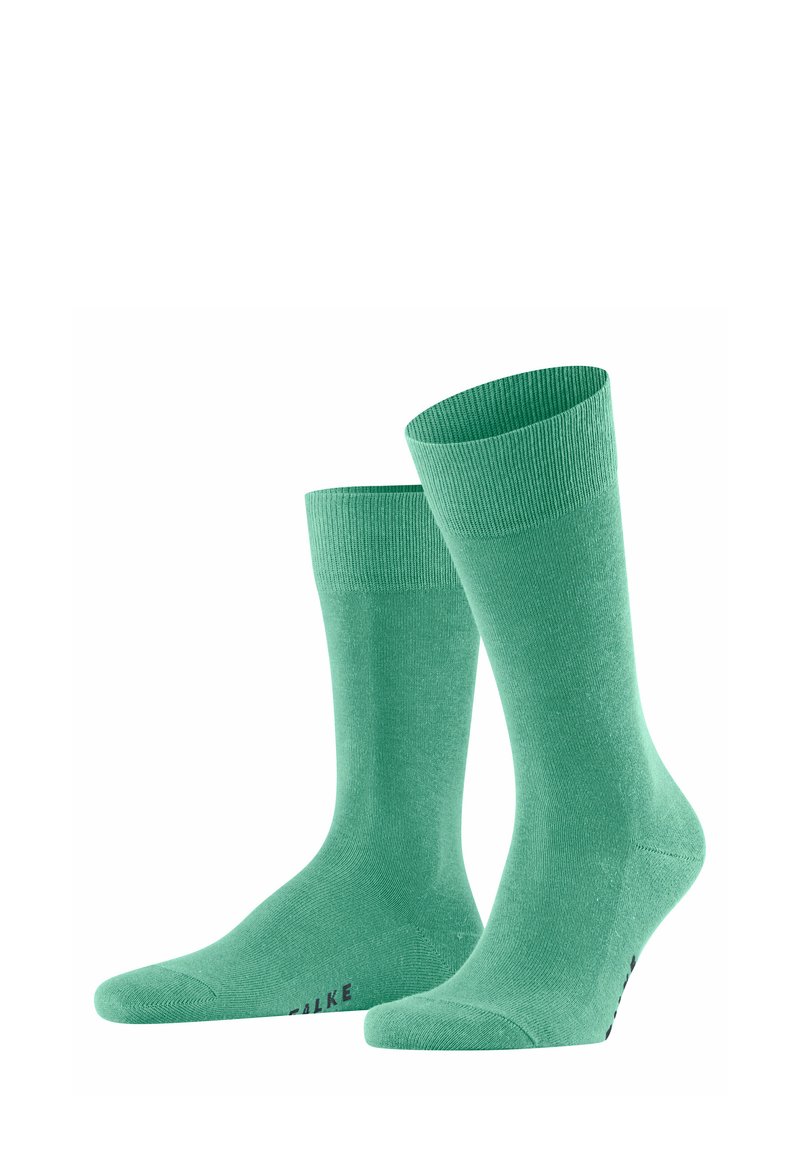 Groene katoenen sokken met een geribde boord en een gladde textuur, met een naadloos te ontwerp en subtiele branding op de zool.
