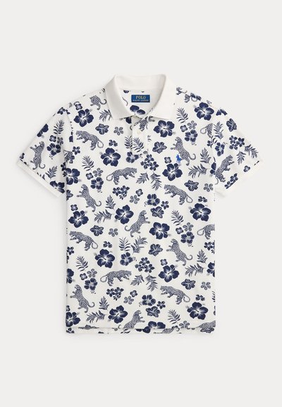 Λευκό πόλο μπλουζάκι με σχέδιο navy λουλουδιών και λεοπάρ, κοντά μανίκια και κλασικό γιακά. Διαθέτει μικρό κεντητό λογότυπο.