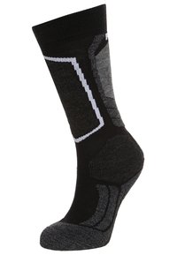Calcetín de patrón negro y gris con punta y talón reforzados, que presenta acentos blancos y un diseño texturizado para mayor agarre.