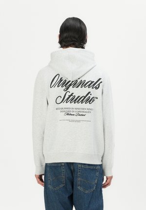 Heather grey hoodie with a drawstring hood, featuring a large black graphic on the back. Soft fabric and ribbed cuffs complete the design.