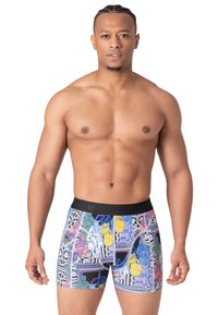 Fekete derékpántos boxer alsó, multicolor grafikai nyomattal, művészi mintákkal, különböző alakzatokkal és formákkal sötét háttéren.