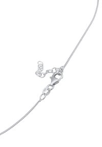 Collana in argento con un design sottile e attorcigliato. Presenta un gancio a moschettone e anelli regolabili per variare la lunghezza.