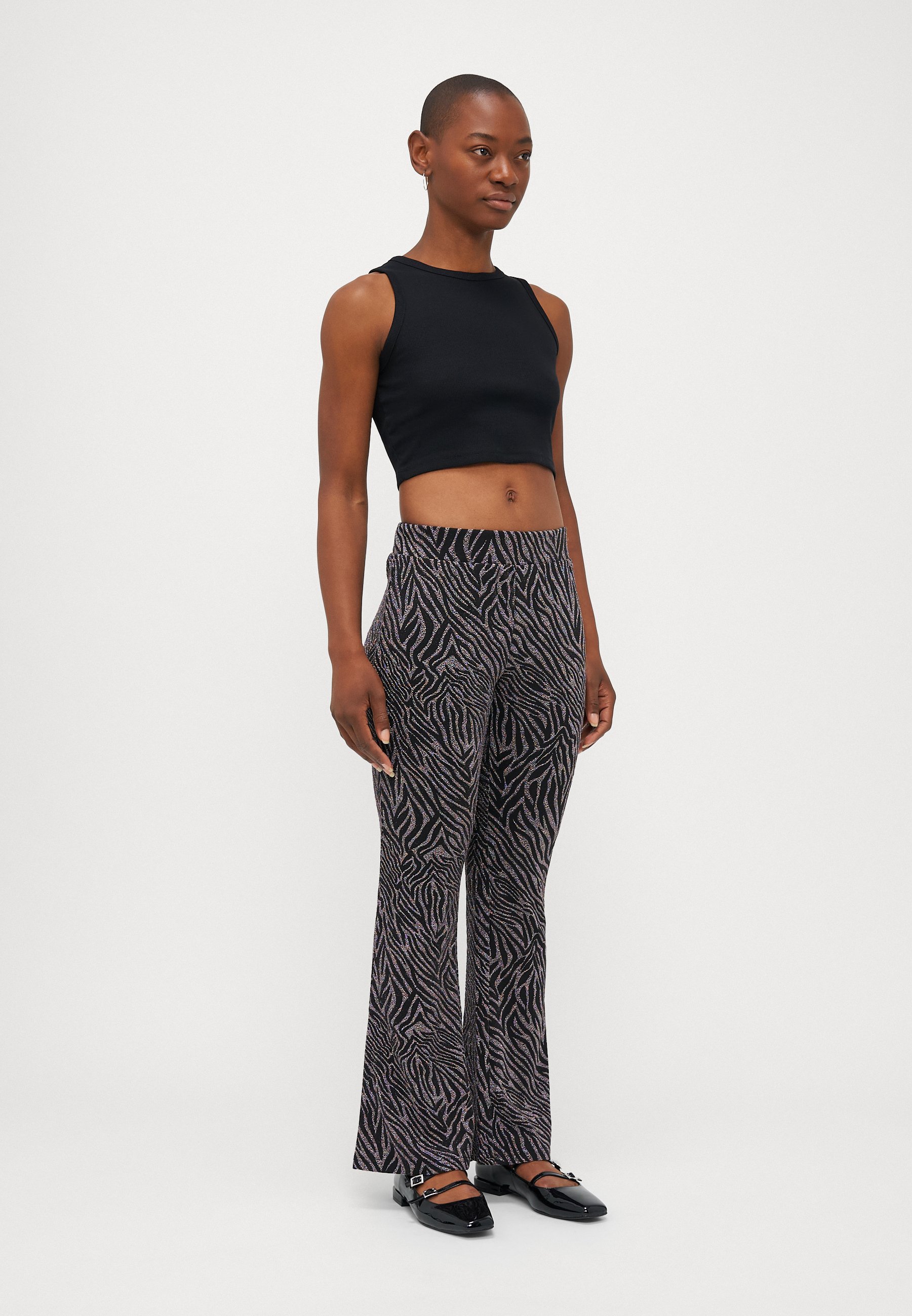 ONLY Petite ONLSHINY FLARED GLITTER - Trousers - black