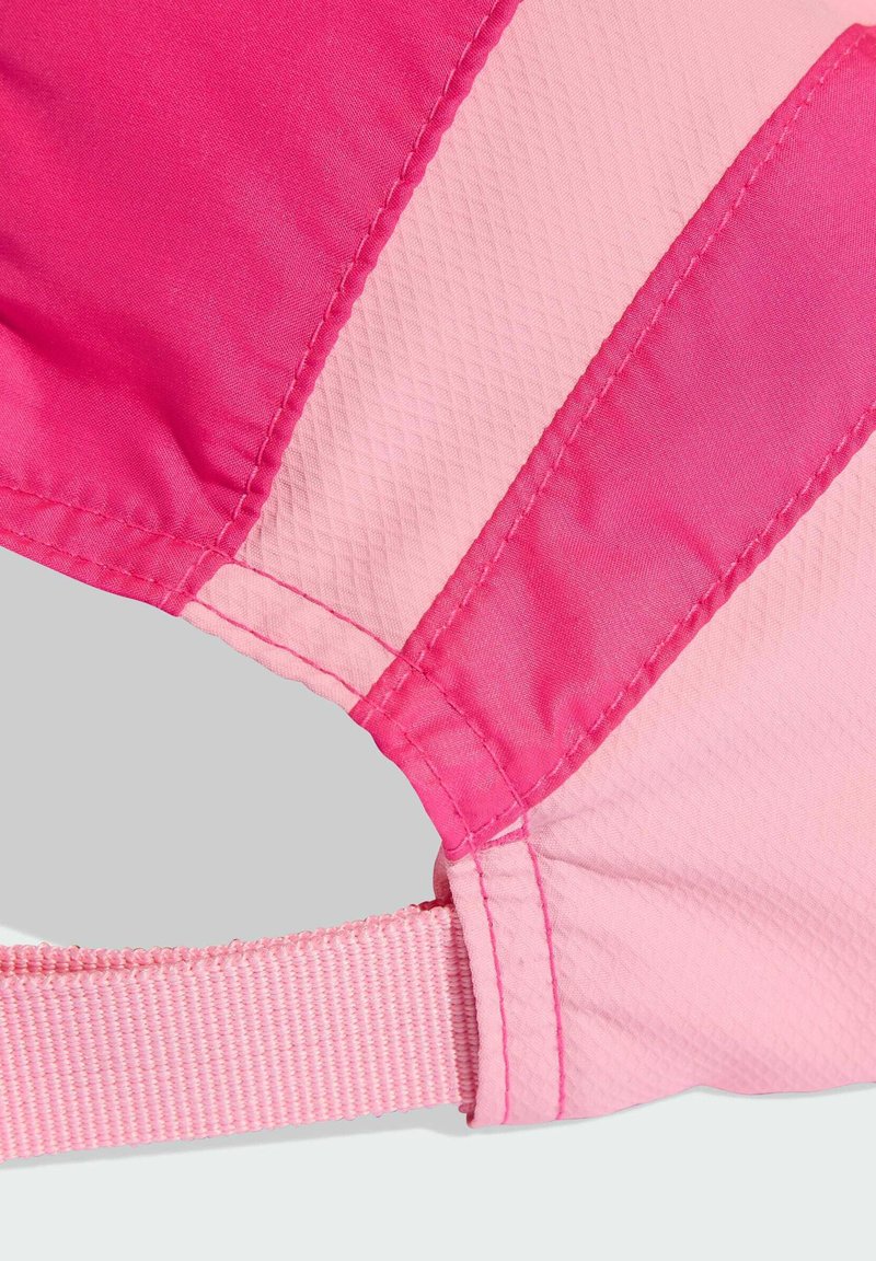 Pink swimwear featuring smooth and textured fabric, with a contrasting design in light and dark pink, and adjustable strap detail.