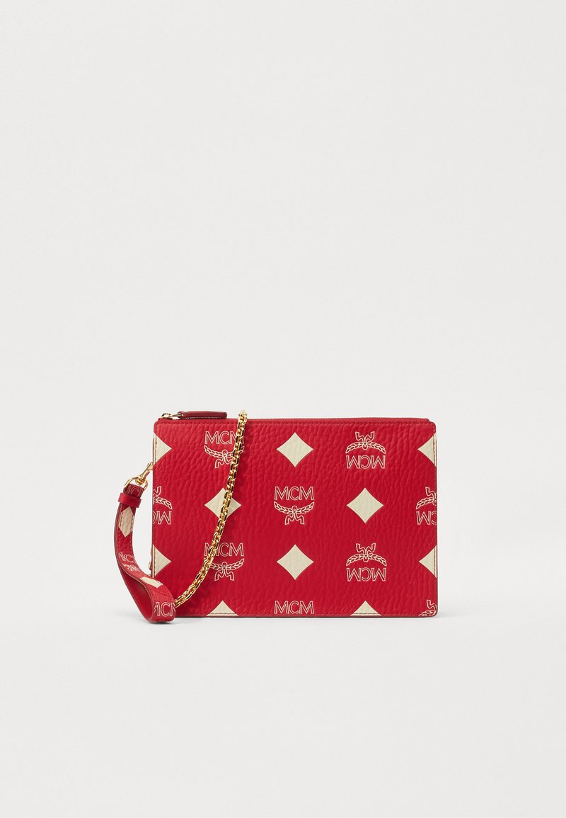 Red leather clutch bag featuring a textured surface, gold chain strap, and a repeating MCM logo with white diamond accents.