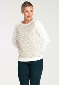 Jasno beżowa bluza z textured wzorem w kompozyt miodu z przodu i białymi rękawami; ściągacze na mankietach i u dołu. Slim fit z miękkim wykończeniem.