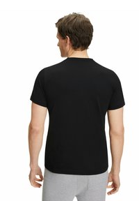 Black short-sleeve t-shirt, round neckline, made of smooth cotton fabric, with a fitted design and no visible logos or patterns on the back.