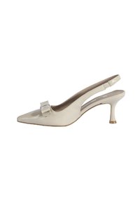 Escarpins slingback beige avec un bout pointu, un petit talon et un nœud décoratif sur le devant. Fabriqués en cuir lisse et brillant.