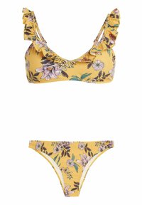 Keltainen kukallinen bikni, jossa on röyhelösoljet, pinkki- ja vihertävä kukkakuosi. Yläosa on kolmion muotoinen ja alaosa on klassinen leikkaus.