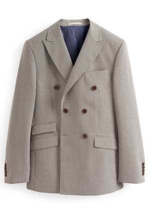 Veste homme croisée beige et marron à carreaux, avec revers à pointe, boutons marron, poches à rabat et doublure intérieure bleu foncé.
