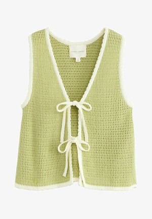Jasnozielony dzianinowy kamizelka z dekoltem w kształcie litery V, falbaniastym białym wykończeniem i zapięciem na sznurek z przodu. Posiada fakturowany materiał i otwarte boki.