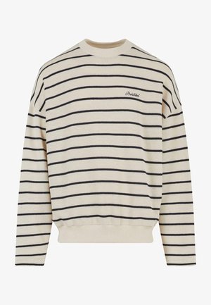 Beige pulóver navy csíkokkal, kerek nyakkivágással és bordás mandzsettával. Az elülső bal oldalán hímzett "Tiltott" felirat található.