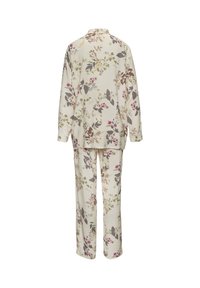 Floral-patterned pajama set in cream, featuring long sleeves and pants. Soft fabric with a relaxed fit, displaying various colorful botanical designs.
