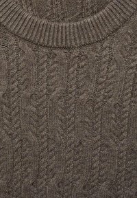 Brown knitted sweater featuring a textured cable pattern and ribbed neckline. The fabric appears soft and thick, suitable for cold weather.