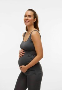 Grå graviditetstopp och leggings, tillverkade av stretchigt material, med en figursydd design, rundad halsringning och jämn textur.