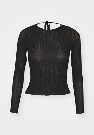 Top nero a maniche lunghe in tessuto a costine con orlo a peplum e chiusura con fiocco sul retro. Materiale morbido con leggero effetto lucido, silhouette aderente.