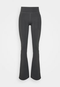 Mörkgrå höga leggings med en hög midja, tillverkade av ett elastiskt, jämnt tyg. Har ton-i-ton sömmar genom hela plagget.