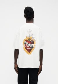 White short-sleeve t-shirt featuring a graphic design of a heart surrounded by flowers and flames, with "ALLSAINTS" text in bold.