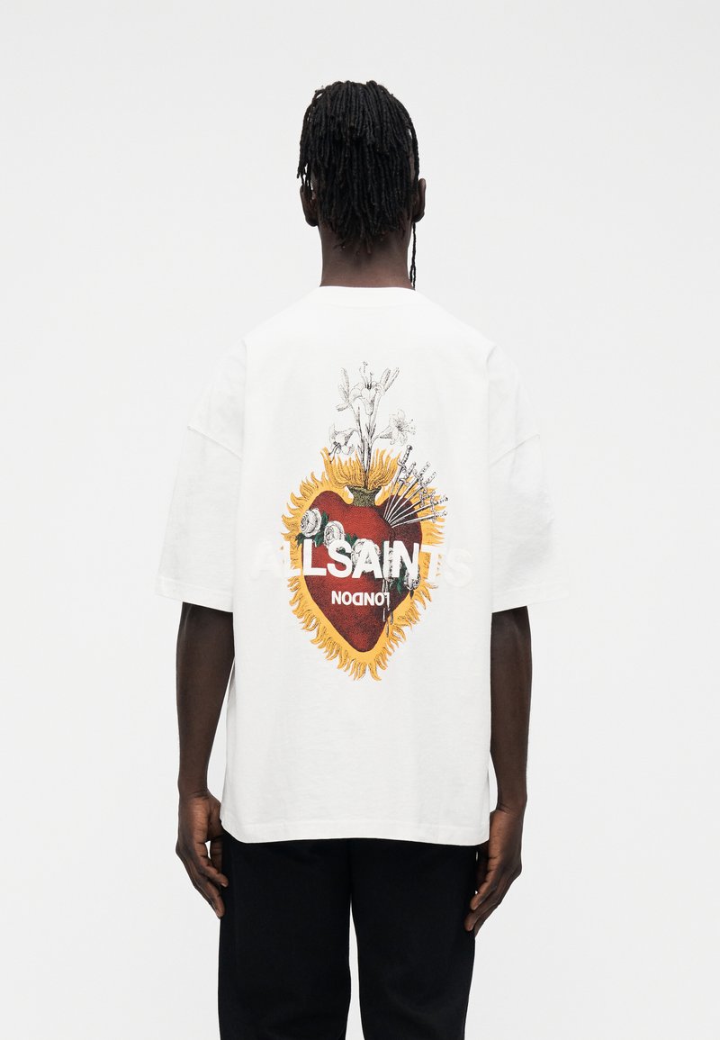 White short-sleeve t-shirt featuring a graphic design of a heart surrounded by flowers and flames, with "ALLSAINTS" text in bold.