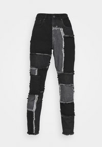 Jeans patchwork neri e grigi con vita alta, orli sfrangiati e un mix di texture in denim, dal design aderente.