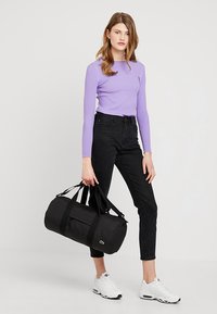 Lacoste ROLL BAG - Sports bag - black
