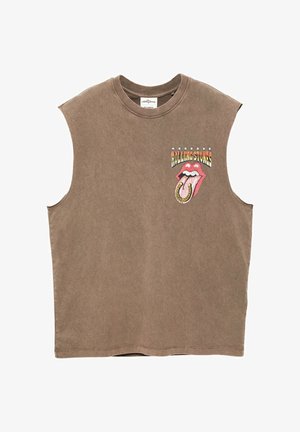Brązowy bezrękawnik z logo Rolling Stones, na którym widnieje czerwone otwarte usta, język i podkowa na środku przedniej części klatki piersiowej.