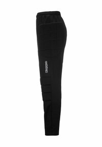 Pantaloni sportivi neri imbottiti con vita elastica, design aderente e grandi dettagli trapuntati sulle cosce. Logo del marchio visibile sulla gamba.