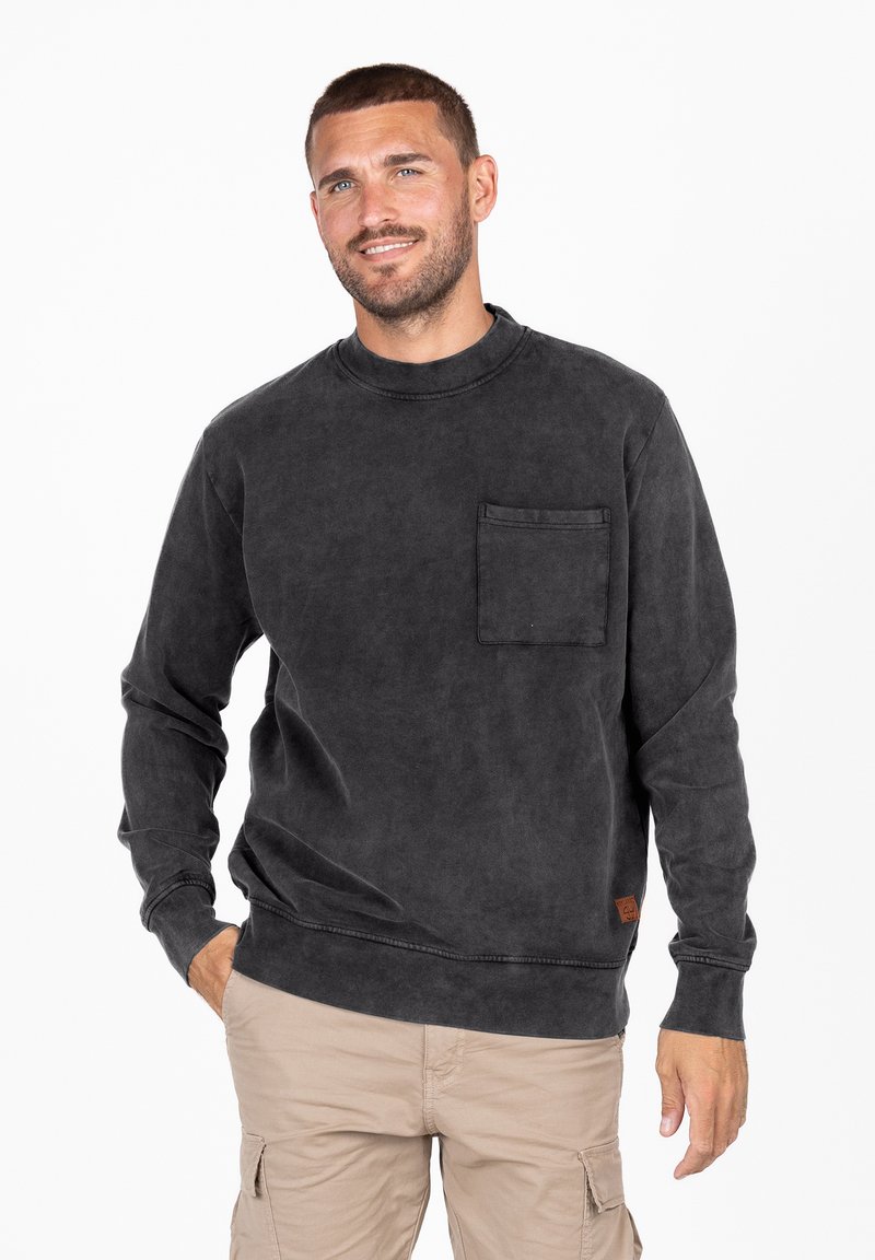 Bluza w kolorze węgla drzewnego wykonana z miękkiego materiału, z okrągłym dekoltem, długimi rękawami i kieszenią z przodu. Minimalistyczny design z dyskretnym przeszyciem.
