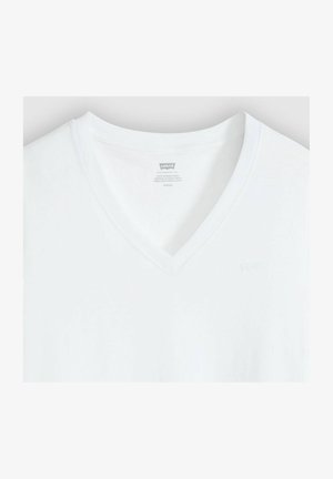 White cotton v-neck t-shirt with a soft texture, featuring a subtle Levi's logo embroidered on the chest and a care label inside the collar.