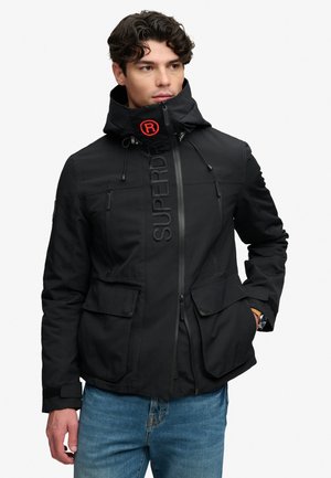 Superdry & Co, SUPERDRY HOODED ULTIMATE EMBROIDERED WINDBREAKER JACKET.. - Chaqueta fina - black pop