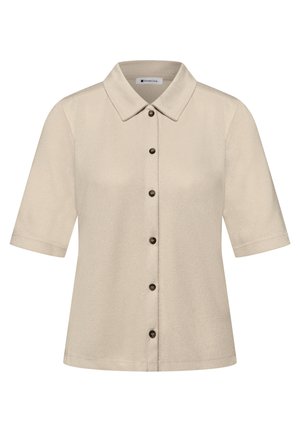 Camicia beige a maniche corte con colletto appuntito e bottoni scuri, realizzata in tessuto morbido e strutturato.