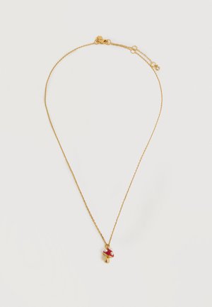 Zarte goldene Halskette mit kleinem roten Pilzanhänger mit weißen Punkten und goldenem Stiel.