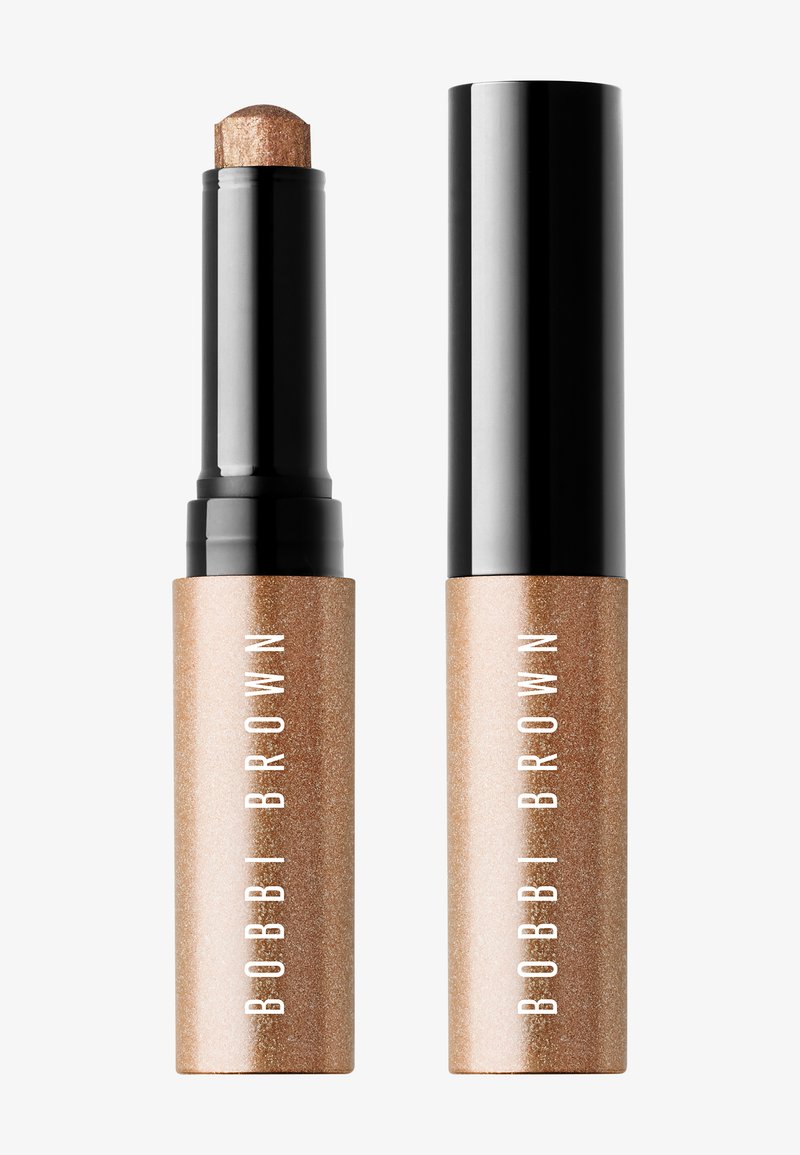 Bobbi Brown shimmer bronze stick with black twist-up cap, shown with cap on and off, isolated on white background.