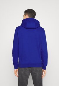 Tommy Jeans REGULAR HOODIE UNISEX - Felpa - navy voyage