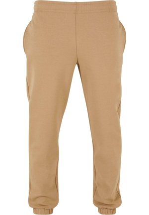 Beige sweatpants van zacht fabric, met zijzakken, een elastische tailleband en elastische boorden bij de enkels.