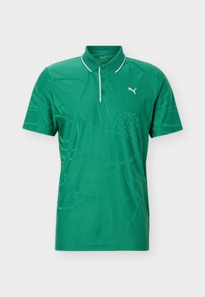 Grünes Polohemd mit kurzen Ärmeln, weißem Besatz am Kragen, subtil gemustertem, tonigem Blumenmuster und weißem Puma-Logo auf der linken Brust.