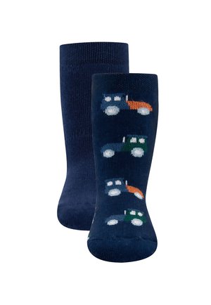 Marinefarbene Socken mit einer weichen Textur, die ein wiederkehrendes Traktormuster in Grün, Blau und Orange auf einem dunklen Hintergrund zeigen.