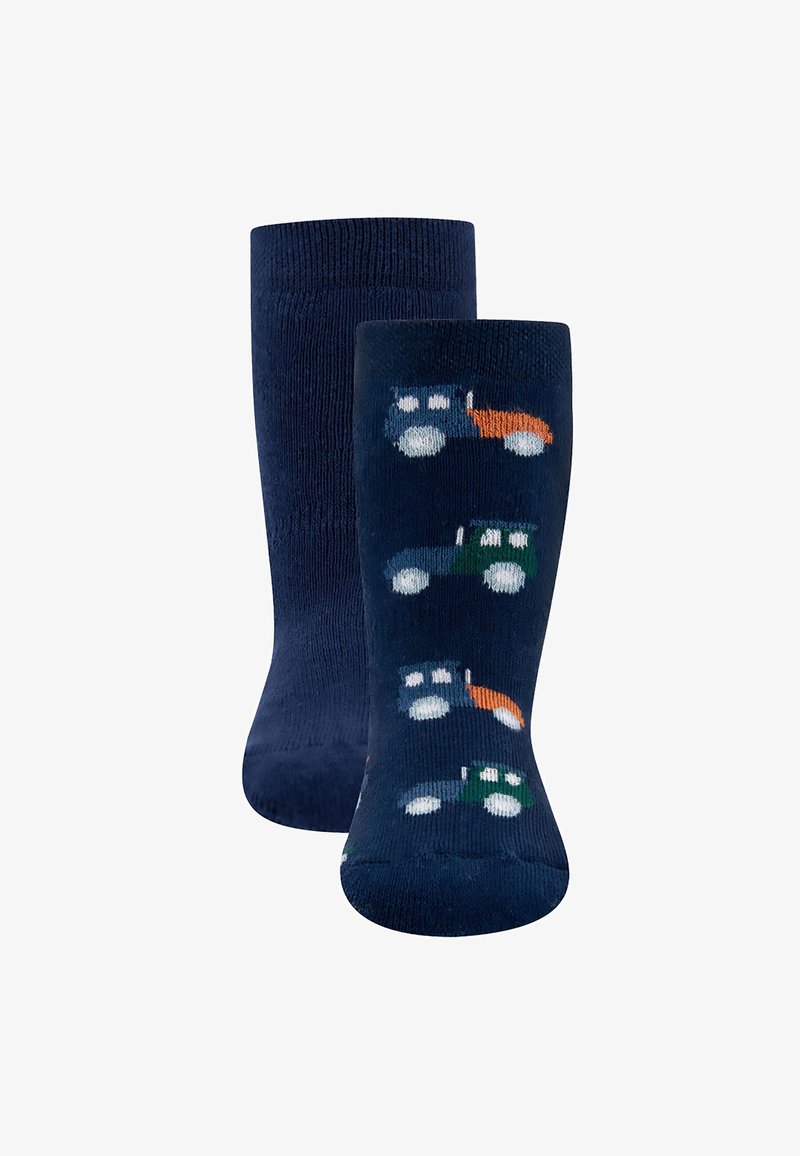 Granatowe skarpetki o miękkiej fakturze z powtarzającym się wzorem ciągnika w kolorze zielonym, niebieskim i pomarańczowym na ciemnym tle.